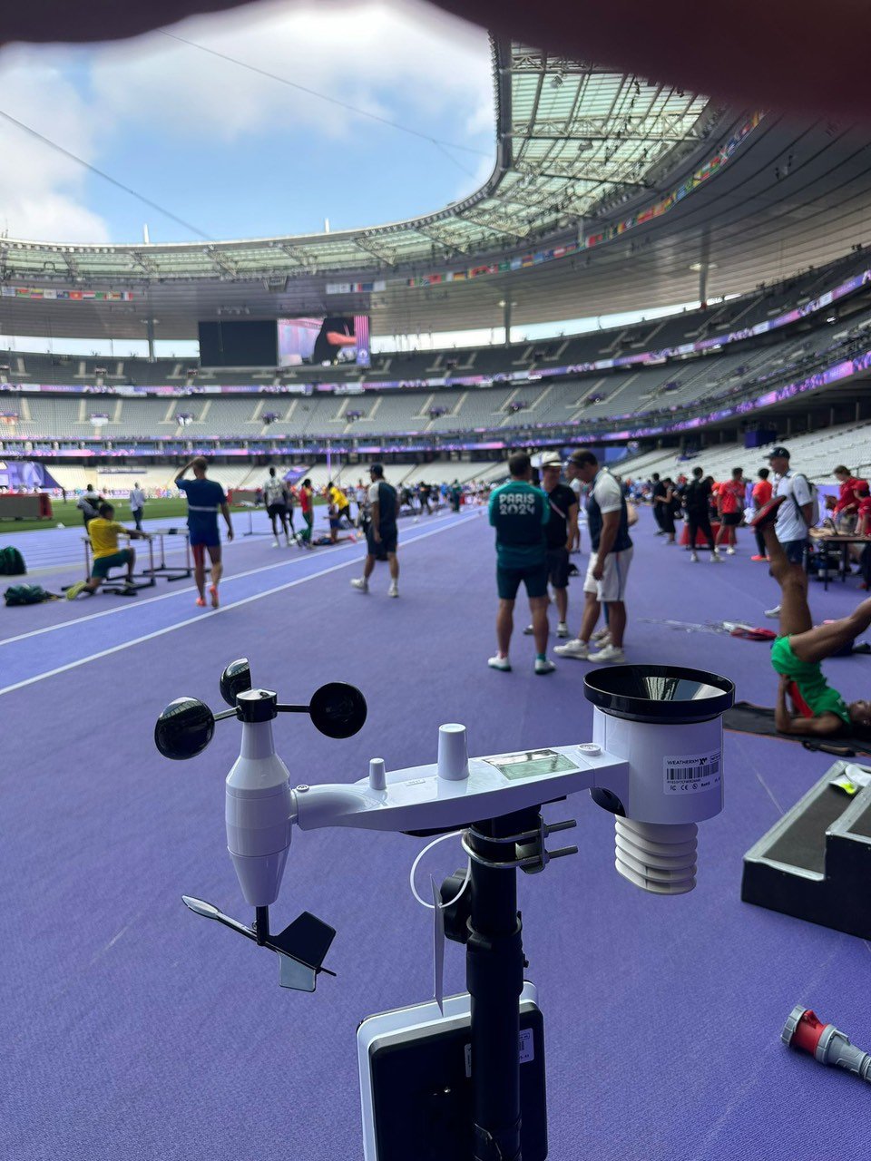 WeatherXM Pulse station on purple Mondo athletics track at Paris 2024 Stade de France
